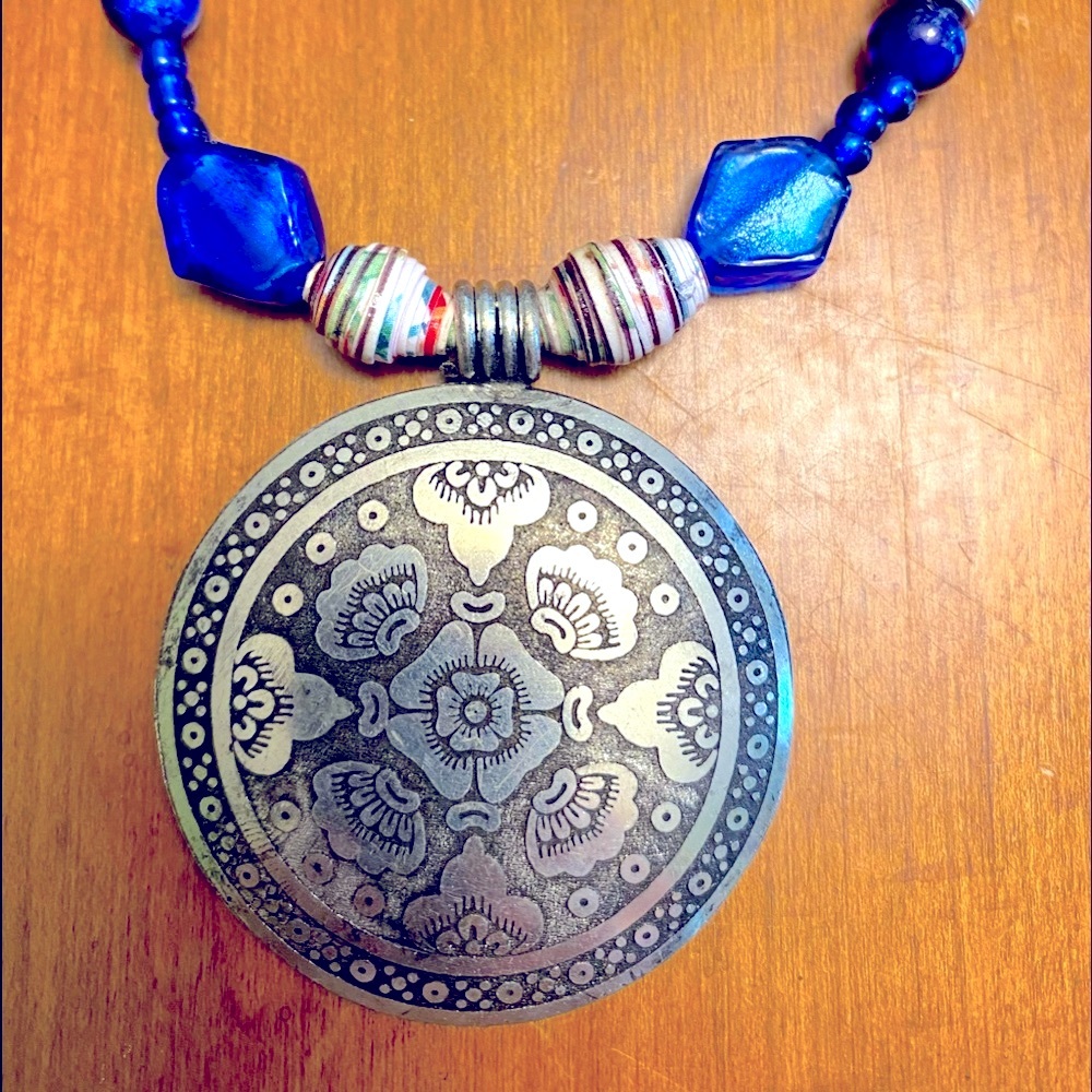 Handcrafted beaded necklace with silver  pendant